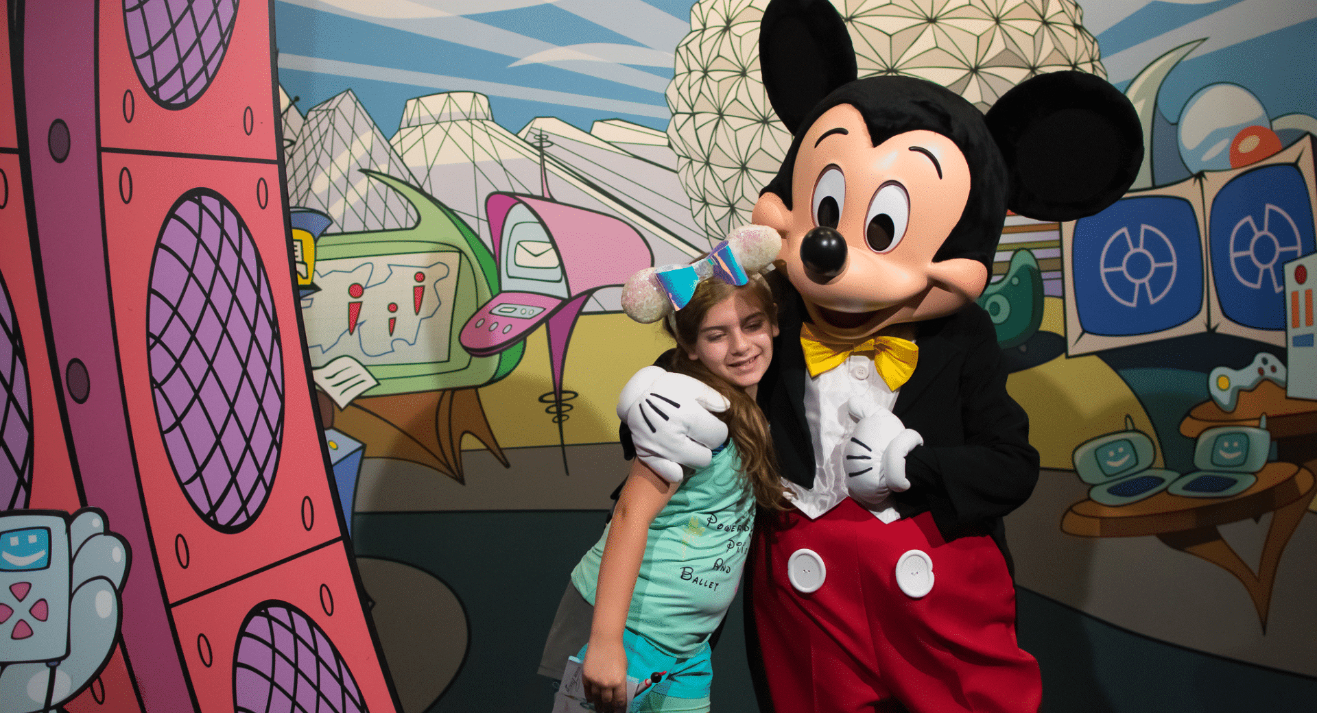 Young girl hugging Mickey Mouse at Epcot