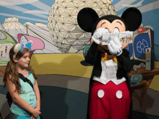 Mickey Mouse signing autographs at Epcot