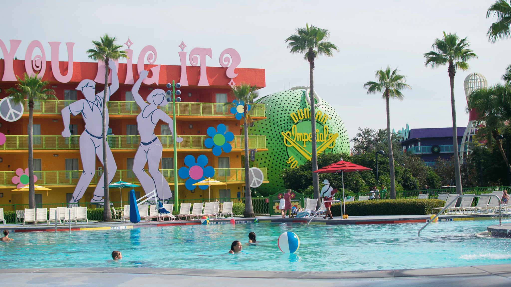 a pool with people in it at Disney's Pop Century Resort 