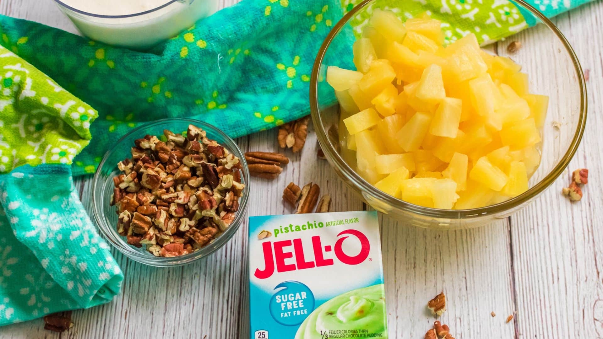 Low sugar watergate salad ingredients: pecans, heavy whipping cream, sugar free pudding and pineapple