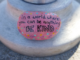 Kindness rock on pole that says "in a world where you can be anything, be kind"
